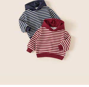Close-up of striped cotton hoodies for boys featuring ribbed cuffs and soft fabric