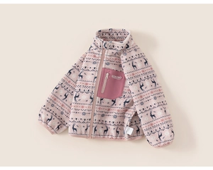 Detail of pink fleece jacket with Nordic reindeer patterns and a small zipper chest pocket