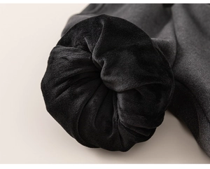 Detailed view of kids thickened trousers featuring warm fleece lining and gray twill fabric