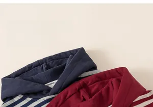 Detailed close-up of striped hooded sweatshirts showing soft knit fabric and hood drawstrings