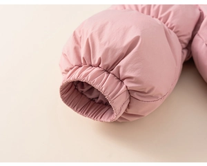 Detailed macro view of the elastic windproof cuff on this pink padded winter jacket