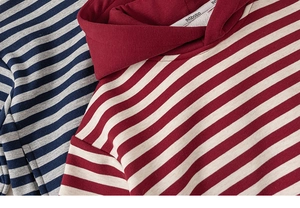 Close-up of soft striped knit hoodies in blue-grey and red-white with INSbobo label