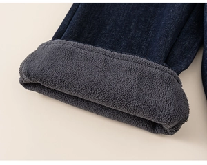 Detail of kids winter jeans showing thick grey fleece lining for warmth and insulation