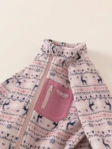 Pink Fair Isle fleece jacket for girls featuring reindeer patterns and zip chest pocket