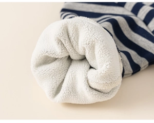 Close-up of thick fleece lining and striped knit cuffs for children winter sweaters