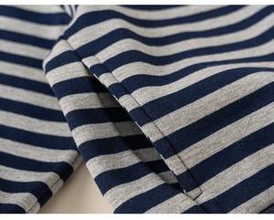 Close-up of navy blue and grey striped kids sweatshirt showing side pocket and stitching
