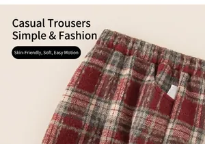 Detail of red and cream plaid kids trousers with elastic waistband and soft brushed fabric