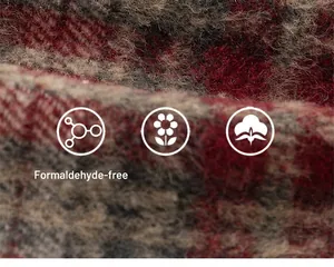 Macro shot of thick red and grey plaid wool fabric texture for cozy girls clothes