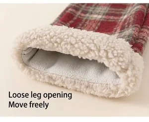 Detail of kids winter plaid pants showing thick white fleece lining and wide leg cuff