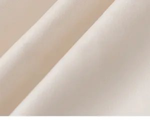Macro view of soft beige twill fabric texture with eco-friendly skin-friendly features
