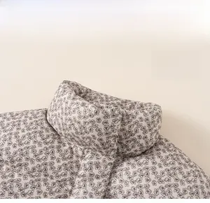 Detail of floral print winter jacket with a thermal stand collar for girls