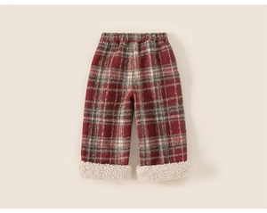 Detail of kids red plaid pants featuring warm sherpa fleece lining and elastic waist