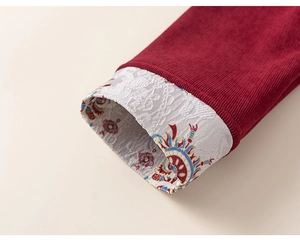 Detailed view of red corduroy cuff with traditional jacquard lining for boys outfit