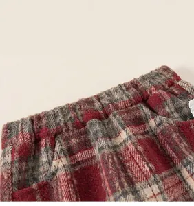 Detail of red and grey plaid knit fabric with elastic waistband and soft brushed texture
