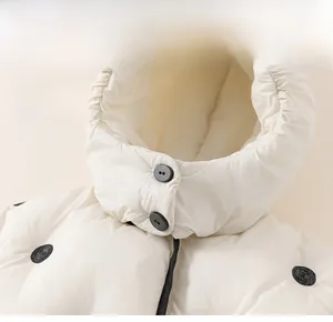 Detail of hooded winter jacket for girls with black polka dots and thermal hood design