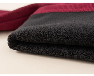 Detail of warm burgundy knit fabric with thick black fleece lining for children winter set