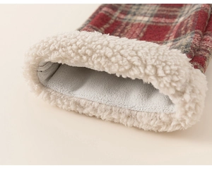 Close-up of red plaid kids sweater featuring thick soft white sherpa fleece lining