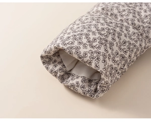 Macro shot of quilted floral sleeve cuffs with warm white lining for winter kid jackets