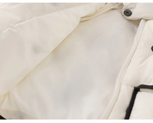 Close-up of smooth inner lining and durable nylon zipper on a warm polka dot kids jacket