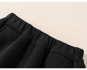 Detail of boys' elastic waistband with thick knit fabric for comfortable warm fit