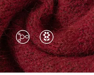 Macro shot of soft thick red knit fabric with fuzzy texture for warm kids sweater