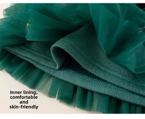 Detail of the soft knit cotton lining and dark green multi-layer tulle tutu skirt