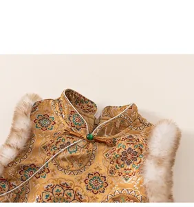 Detail of traditional Chinese New Year outfit with floral embroidery and jade button