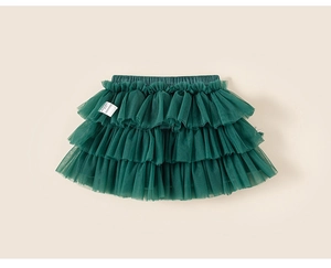 Close-up of layered dark green tulle tutu skirt for girls with elastic waistband detail