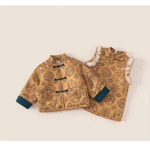Detail of traditional Chinese kids jacket and vest with golden embroidery and fur trim
