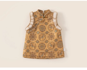 Detailed view of children's gold satin vest with traditional embroidery and fur trim