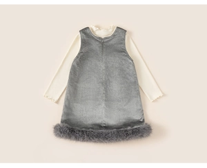 Detail of velvet girl's dress with faux fur trim and pearl collar long sleeve shirt