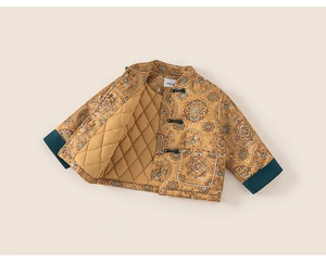 Detail of traditional Chinese quilted cotton jacket for kids with floral patterns and frog buttons
