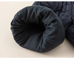 Detail of windproof quilted winter pants showing thick insulation and soft grey lining