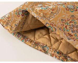 Macro detail of Chinese jacquard fabric with golden auspicious pattern and quilted lining
