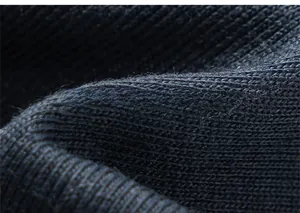 Detailed macro view of navy blue ribbed knit fabric with warm fleece texture