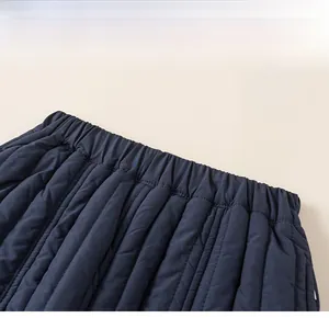 Detail of the elastic waistband on thick navy blue quilted winter trousers for children