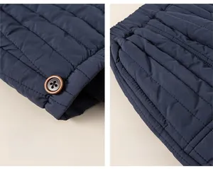 Close-up of quilted winter pants featuring brown decorative buttons and functional side pockets