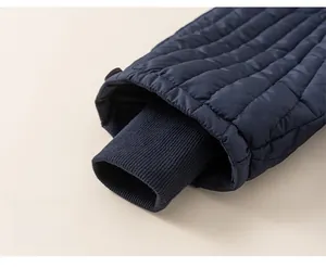Detail of windproof quilted pants featuring elastic ribbed cuffs for warmth and insulation