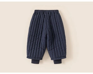 Close-up of kids navy blue quilted thermal pants with elastic waistband and ribbed cuffs