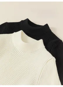 Detailed view of black and beige ribbed knit sweaters with soft half-high collar texture