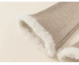 Detail of children's warm vest featuring ribbed knit fabric and thick faux fur lining