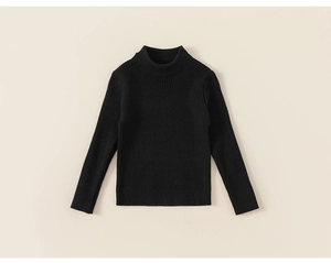 Detail of black rib-knit long sleeve sweater with premium texture and refined cuffs