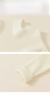 Detailed view of the ribbed knit neckline and elastic cuffs on a warm beige kids' sweater