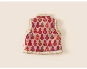 Detail of girls pink corduroy vest with faux fur trim and traditional calabash pattern