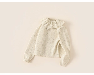 Close-up of ruffled collar detail on thick warm knit sweater for children