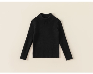 Close-up of black ribbed knit texture on long sleeve turtleneck thermal top for girls