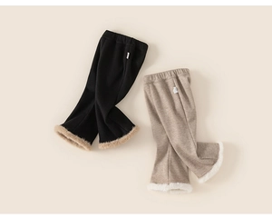 Close-up of knit toddler flare pants with elastic waist and faux fur trim at the leg cuffs