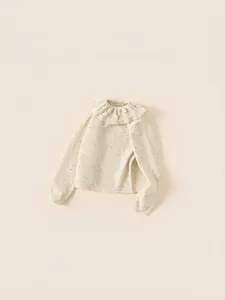 Cream knit sweater for girls with colorful flecks and ruffled floral collar details
