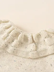 Girl's thick knit sweater featuring a vintage double ruffle collar and colorful speckles