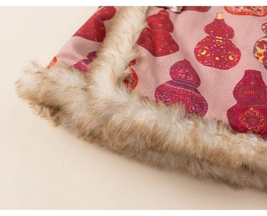 Detail of pink corduroy vest with gourd print and soft faux fur trim for kids